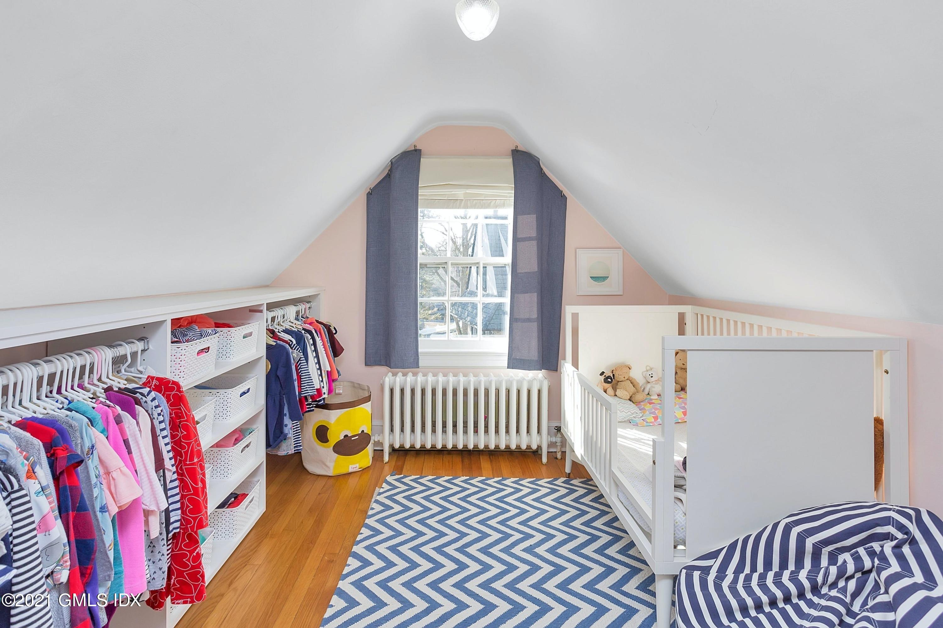 24 Valleywood Road Cos Cob, CT 06830 - Photo 15 of 24 a bedroom with a bed and a window