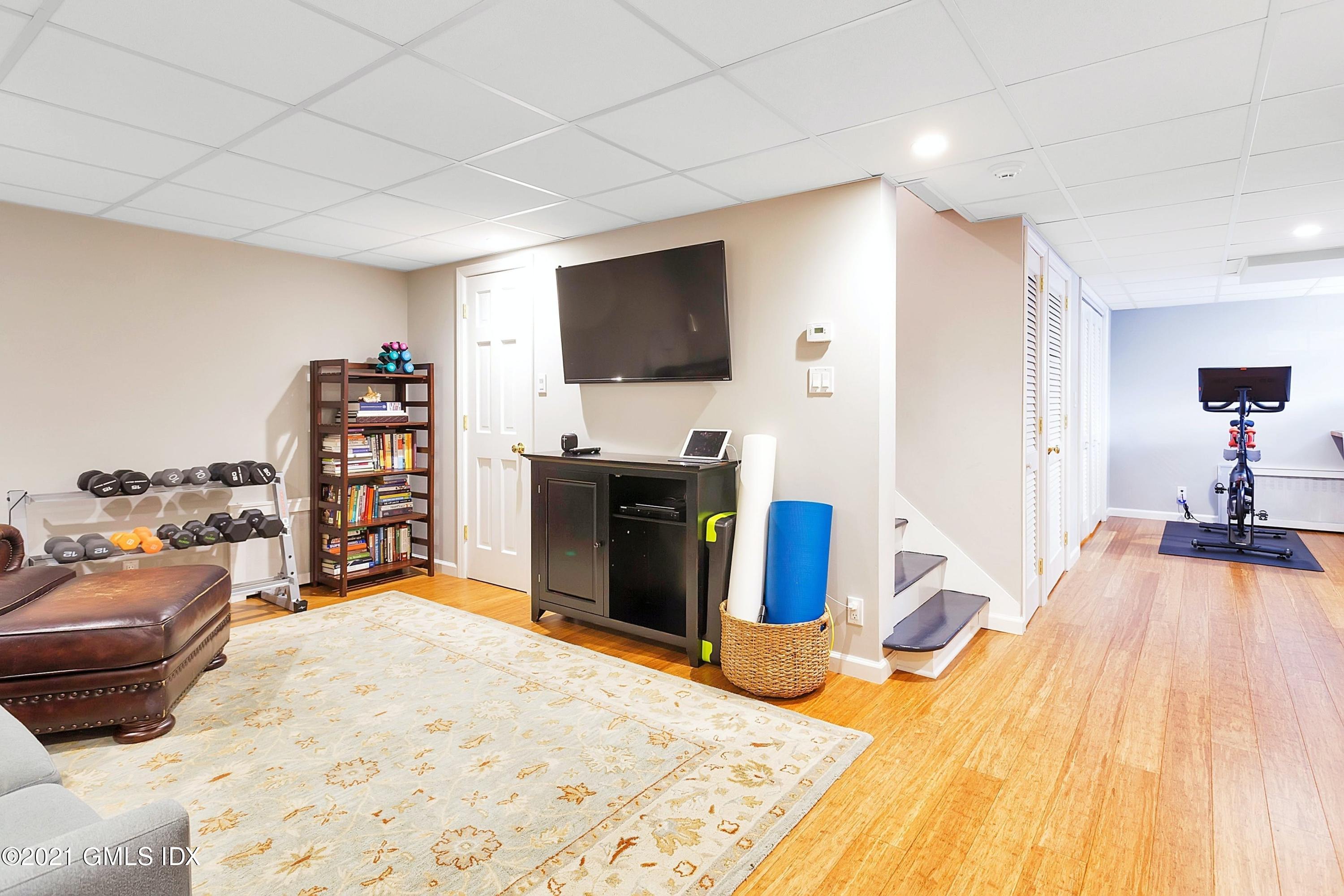 24 Valleywood Road Cos Cob, CT 06830 - Photo 16 of 24 a living room with furniture and a flat screen tv