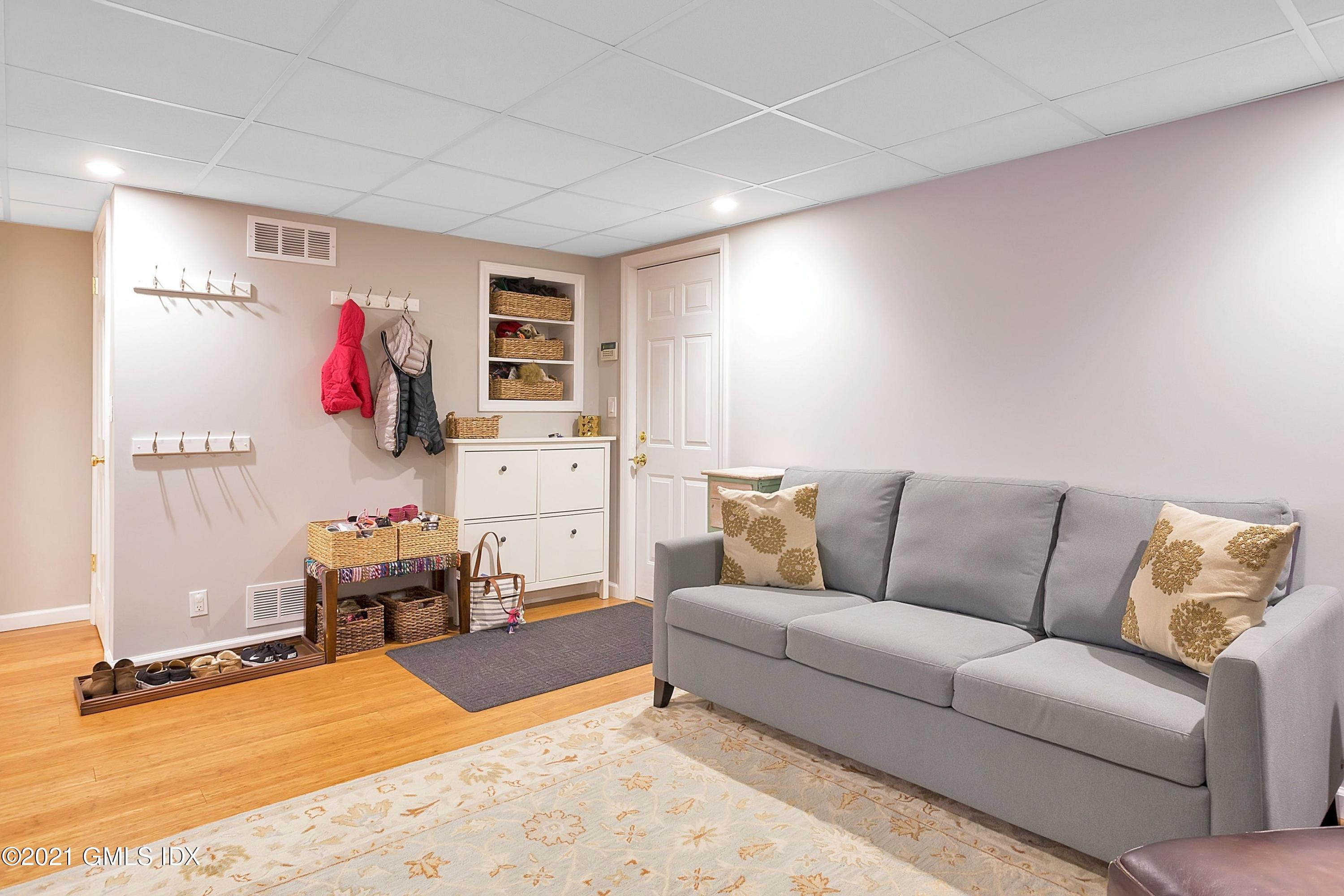 24 Valleywood Road Cos Cob, CT 06830 - Photo 17 of 24 a living room with furniture cabinets and window