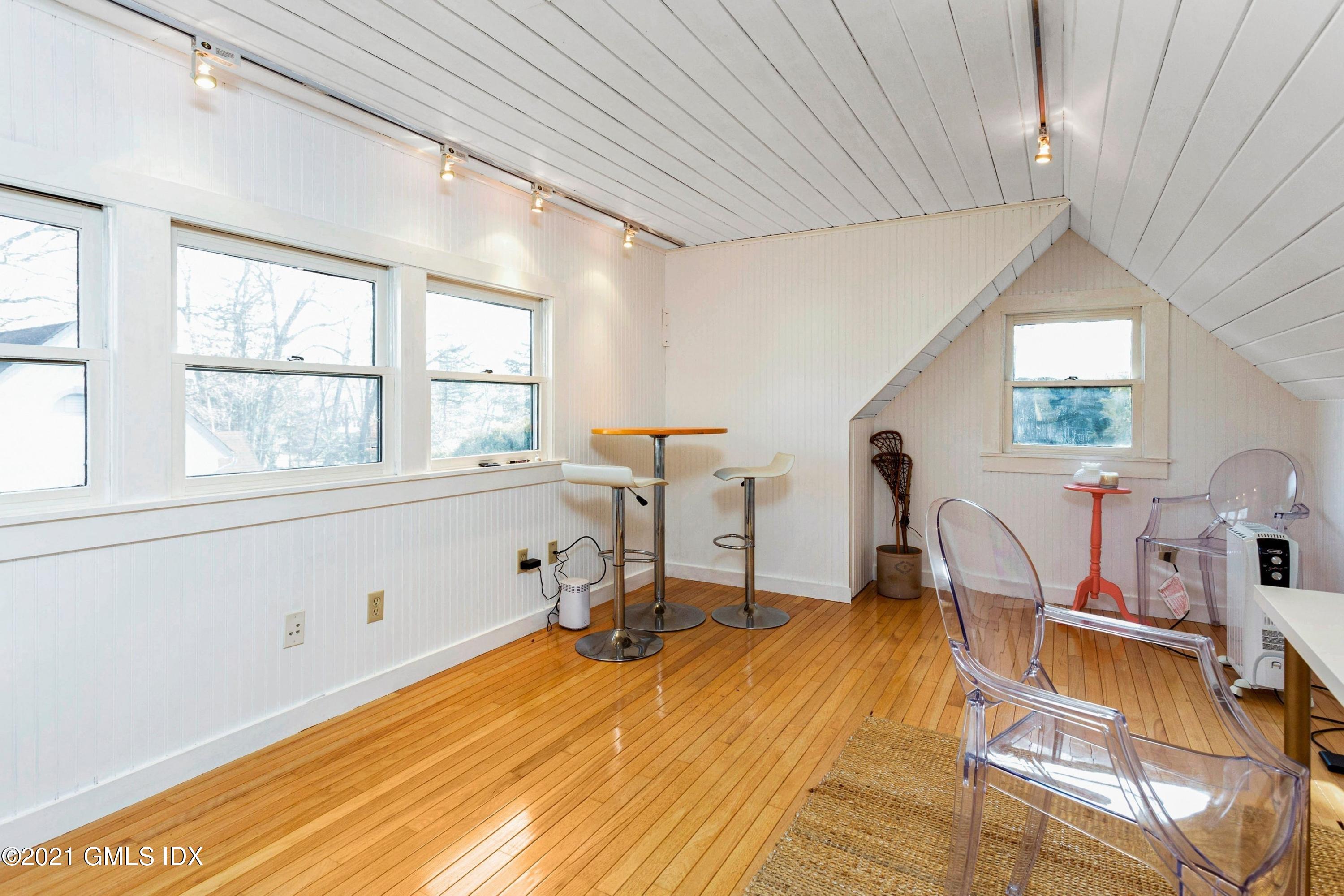 24 Valleywood Road Cos Cob, CT 06830 - Photo 22 of 24 a room with gym equipment and windows