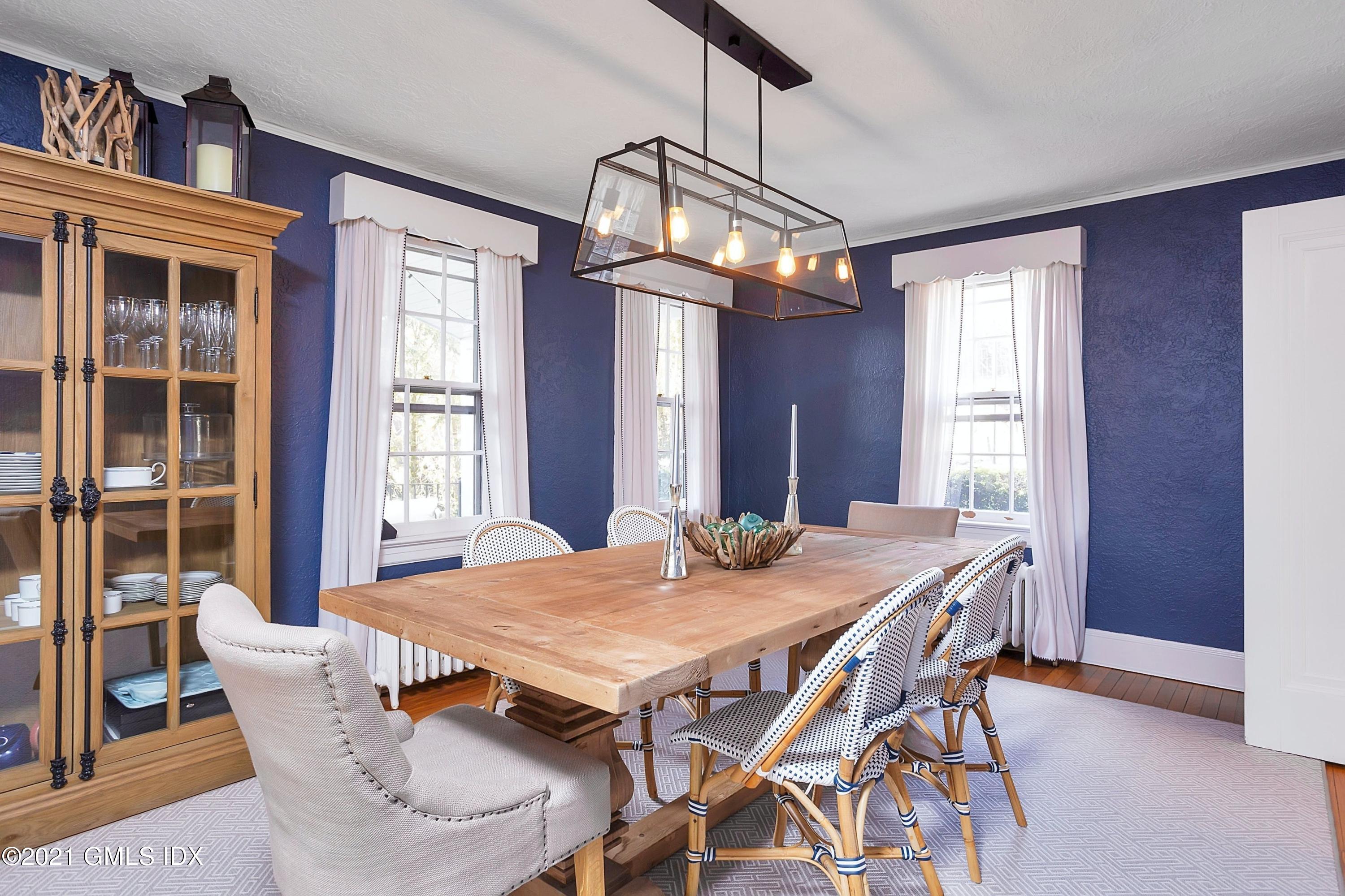 24 Valleywood Road Cos Cob, CT 06830 - Photo 7 of 24 a view of a dining room with furniture window and wooden floor