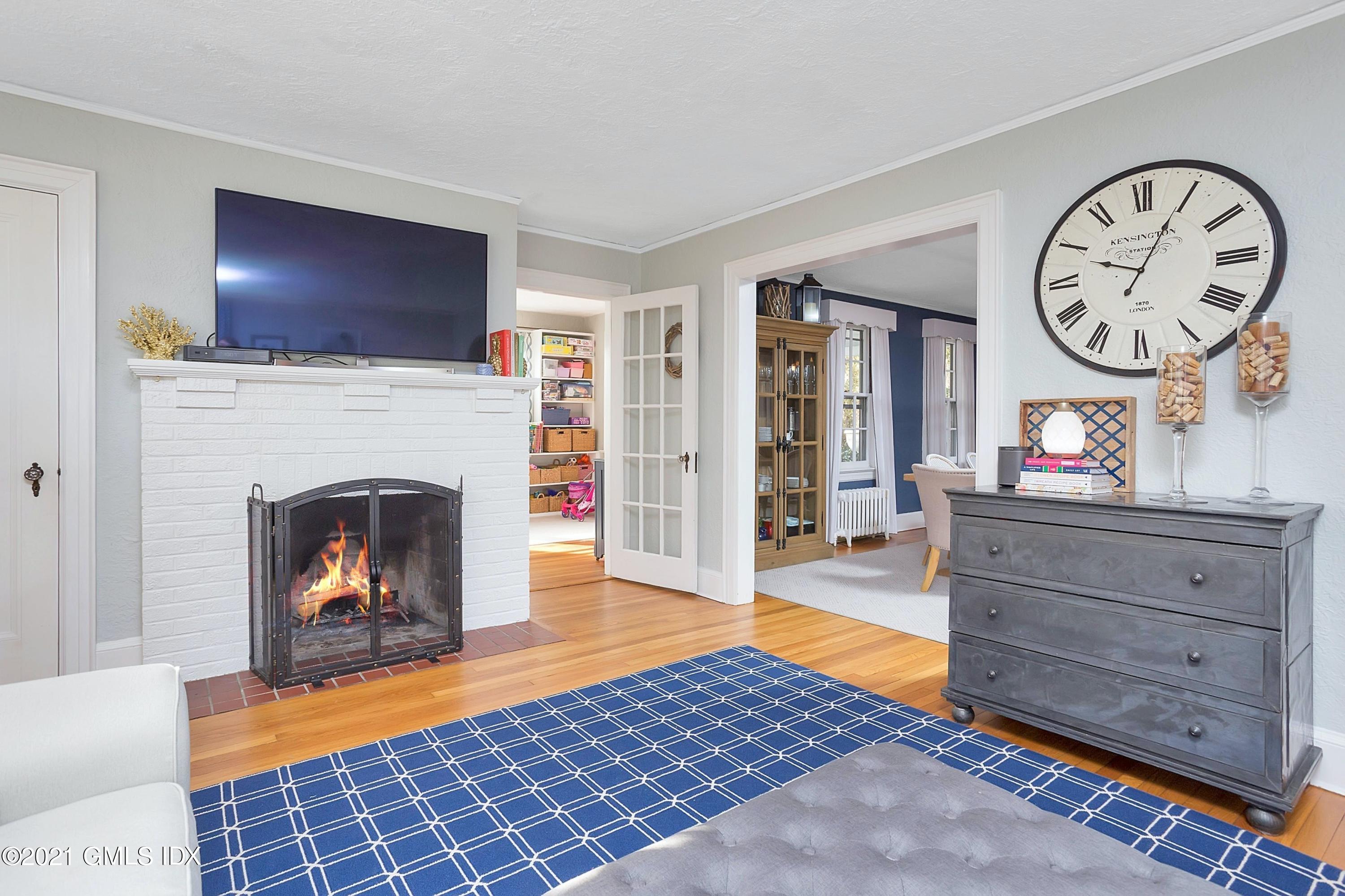 24 Valleywood Road Cos Cob, CT 06830 - Photo 8 of 24 a living room with furniture and a fireplace