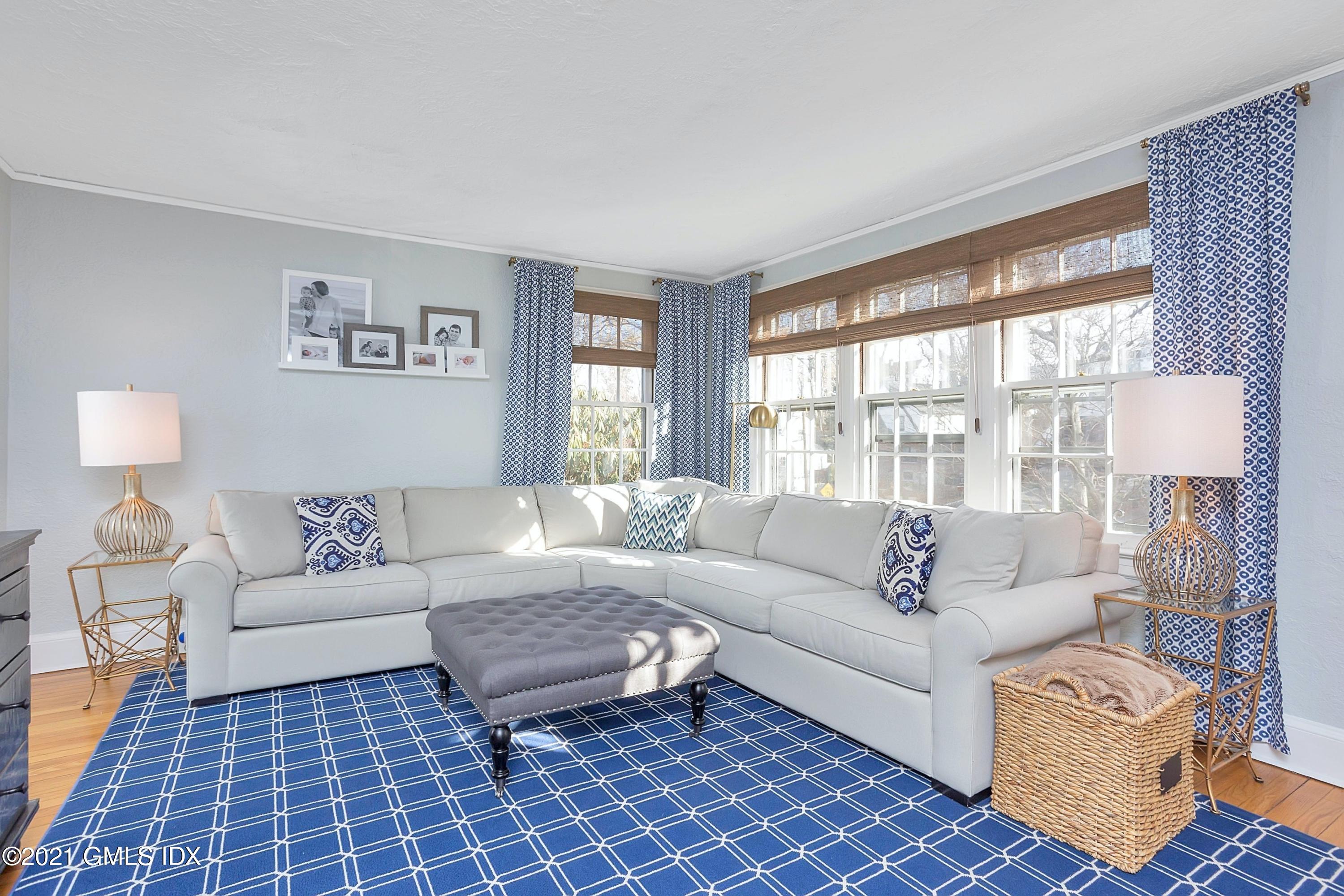 24 Valleywood Road Cos Cob, CT 06830 - Photo 9 of 24 a living room with furniture and a large window