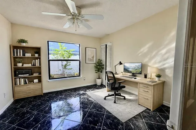 a workspace with furniture and window