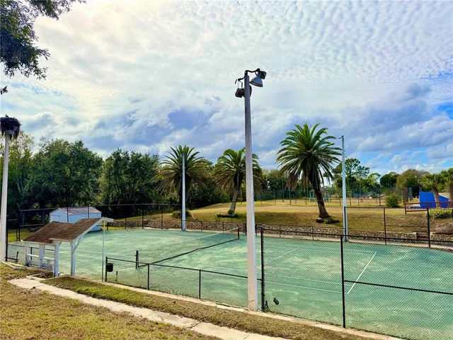 a view of a patio with a table and chairs