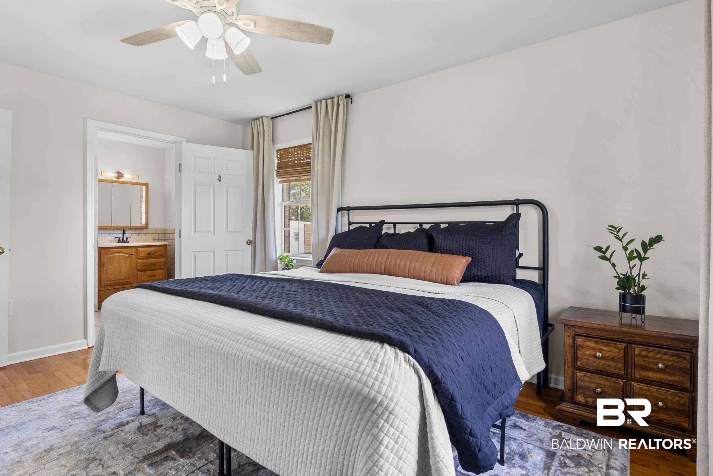 17689 Brewer Road Foley, AL 36535 - Photo 38 of 54 Bedroom featuring ensuite bath, ceiling fan, dark hardwood / wood-style floors, and sink