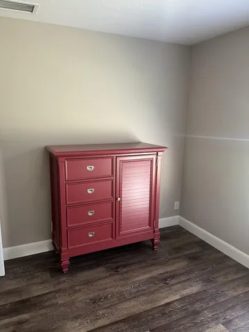 a room with a dresser