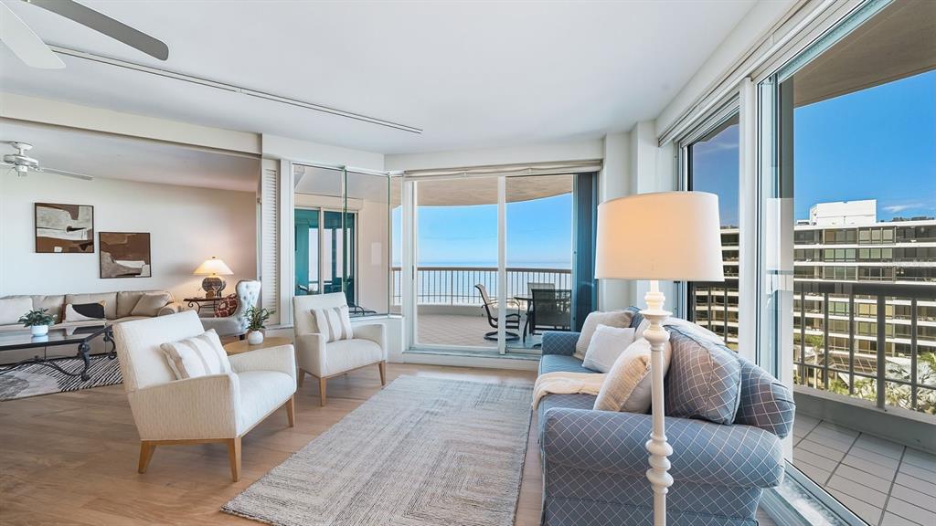 455 Longboat Club Road, Unit 707 Longboat Key, FL 34228 - Photo 14 of 69 a living room with furniture and a table