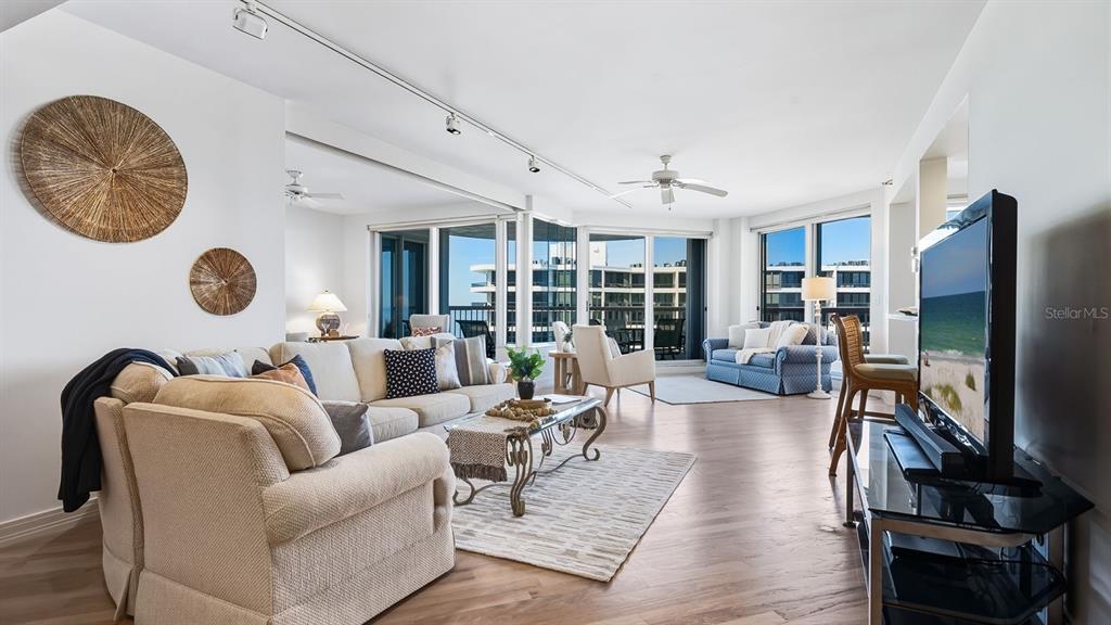 455 Longboat Club Road, Unit 707 Longboat Key, FL 34228 - Photo 16 of 69 a living room with furniture and a flat screen tv