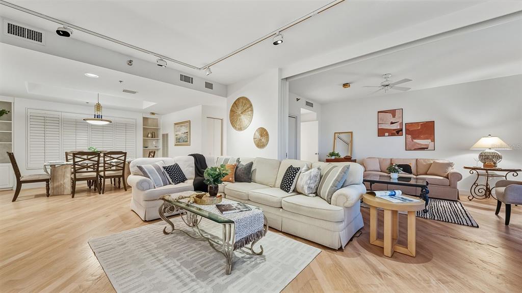 455 Longboat Club Road, Unit 707 Longboat Key, FL 34228 - Photo 19 of 69 a living room with furniture and wooden floor