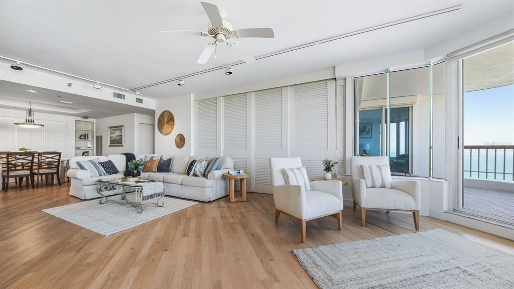 455 Longboat Club Road, Unit 707 Longboat Key, FL 34228 - Photo 20 of 69 a living room with furniture and wooden floor