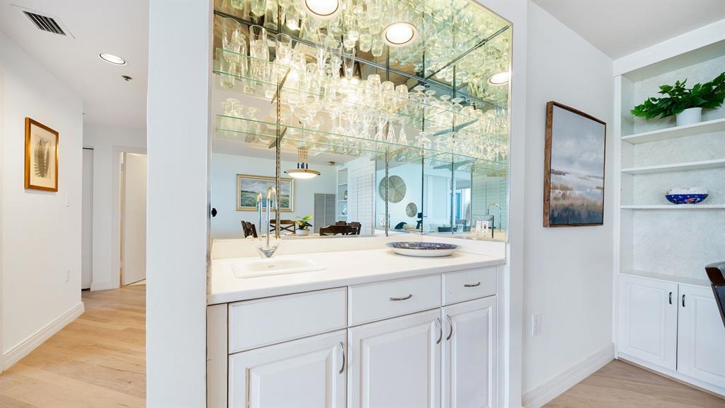 455 Longboat Club Road, Unit 707 Longboat Key, FL 34228 - Photo 30 of 69 a bathroom with a sink and a mirror