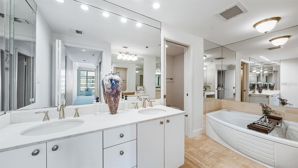 455 Longboat Club Road, Unit 707 Longboat Key, FL 34228 - Photo 36 of 69 a bathroom with a double vanity sink mirror and double