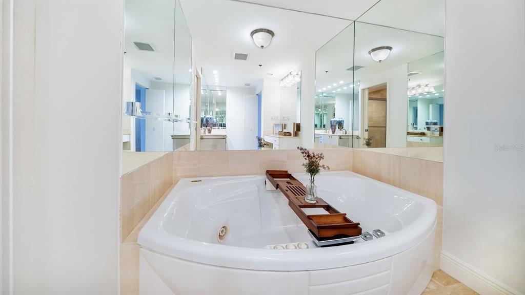 455 Longboat Club Road, Unit 707 Longboat Key, FL 34228 - Photo 37 of 69 a bathroom with a tub a sink and a window
