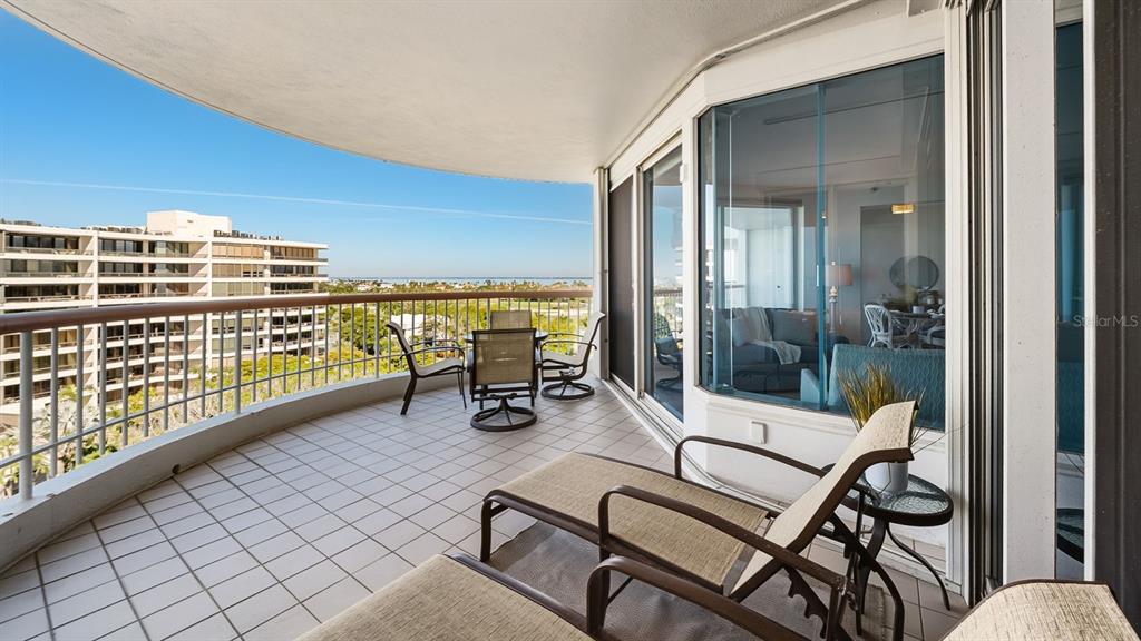 455 Longboat Club Road, Unit 707 Longboat Key, FL 34228 - Photo 44 of 69 a view of a balcony with two chairs and a table