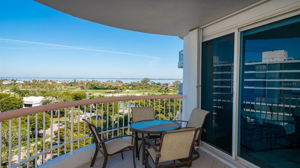 455 Longboat Club Road, Unit 707 Longboat Key, FL 34228 - Photo 45 of 69 a view of a chairs and table in patio