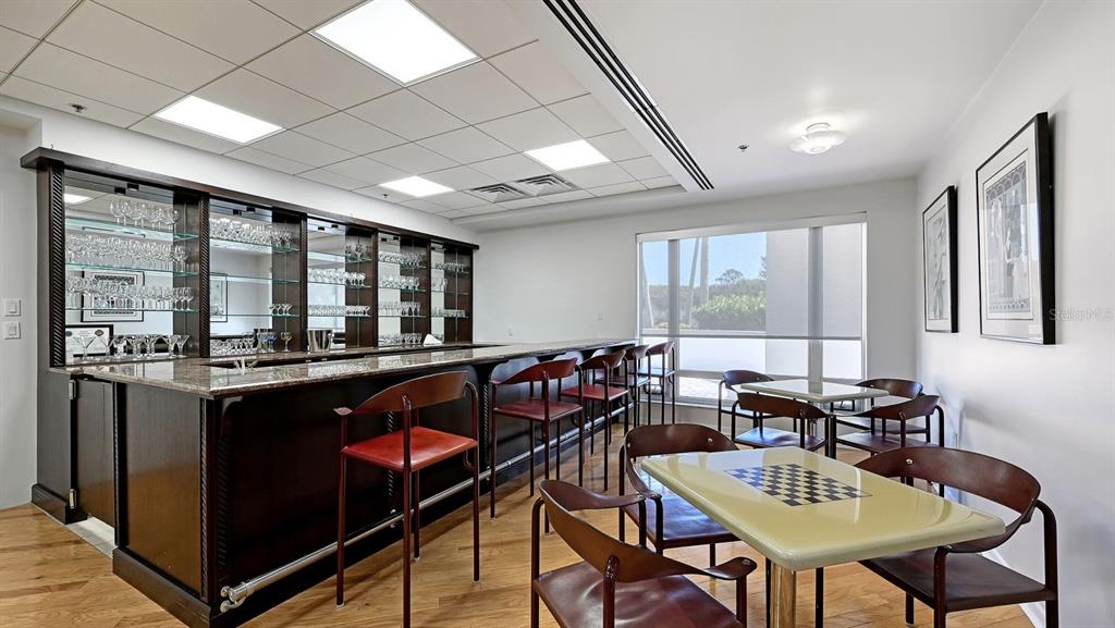 455 Longboat Club Road, Unit 707 Longboat Key, FL 34228 - Photo 65 of 69 a view of a dining room with furniture window and outside view