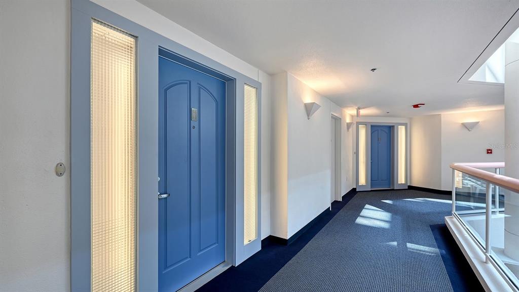 455 Longboat Club Road, Unit 707 Longboat Key, FL 34228 - Photo 10 of 69 a view of a hallway with wooden shelves
