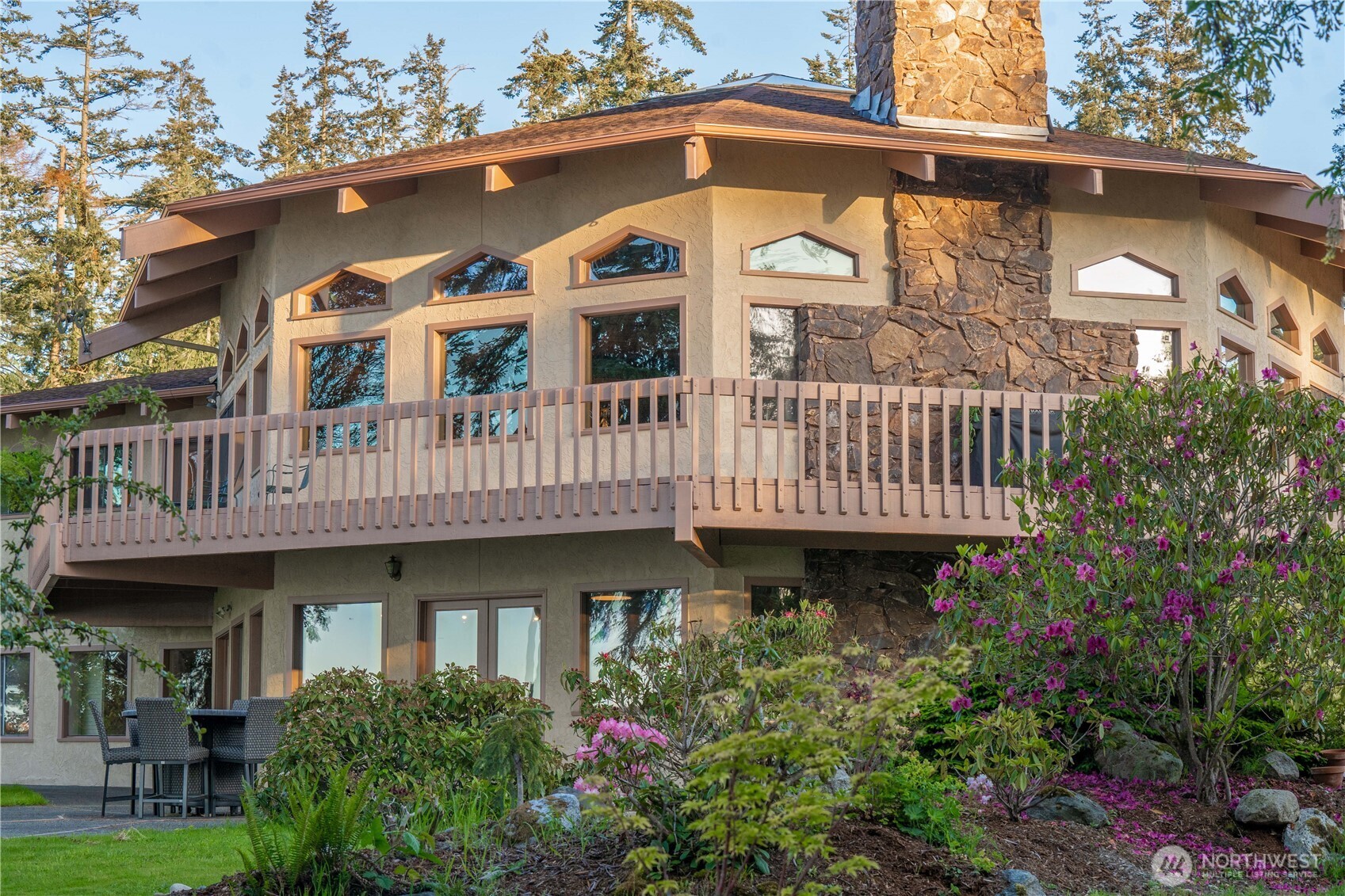 491 Bachelor Road Sequim, WA 98382 - Photo 30 of 39 a front view of a house with plants and balcony