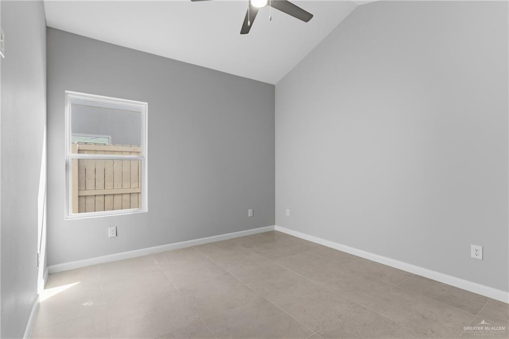 2612 Mockingbird Road, Unit 4 Weslaco, TX 78596 - Photo 11 of 11 an empty room with ceiling fan and window