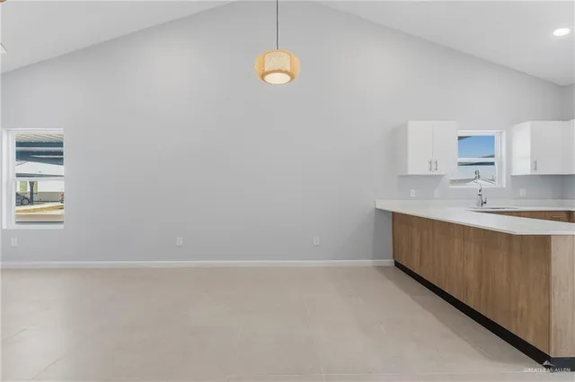 a bathroom with a sink and a window