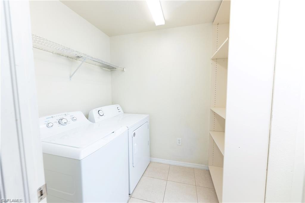 7975 Preserve Circle, Unit 1013 Naples, FL 34119 - Photo 16 of 16 a utility room with dryer and washer