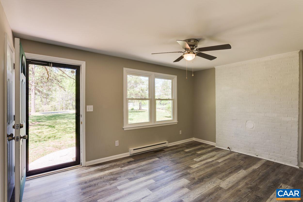 2982 Cedar Lane Road Kents Store, VA 23084 - Photo 6 of 35 a view of empty room with wooden floor and fan