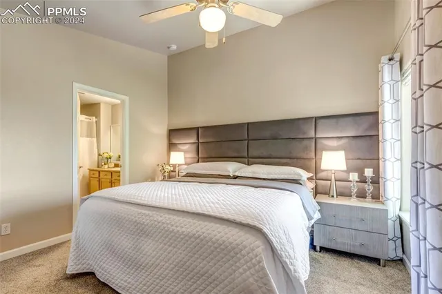 a bedroom with a bed and a mirror