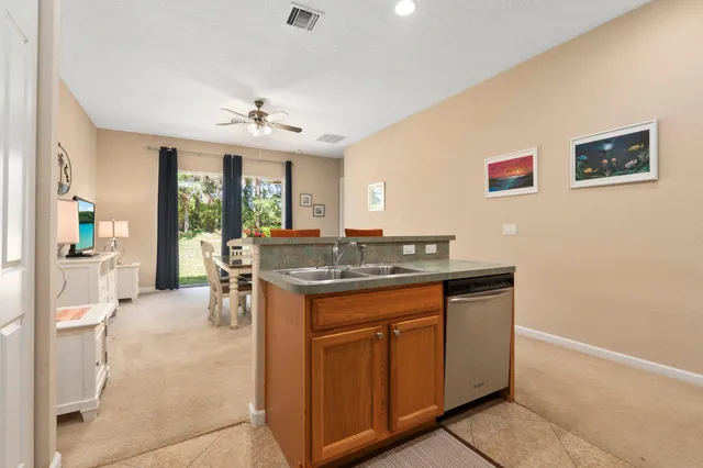a kitchen with a sink cabinets and window