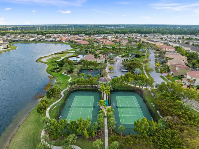 an aerial view of a houses with a lake view