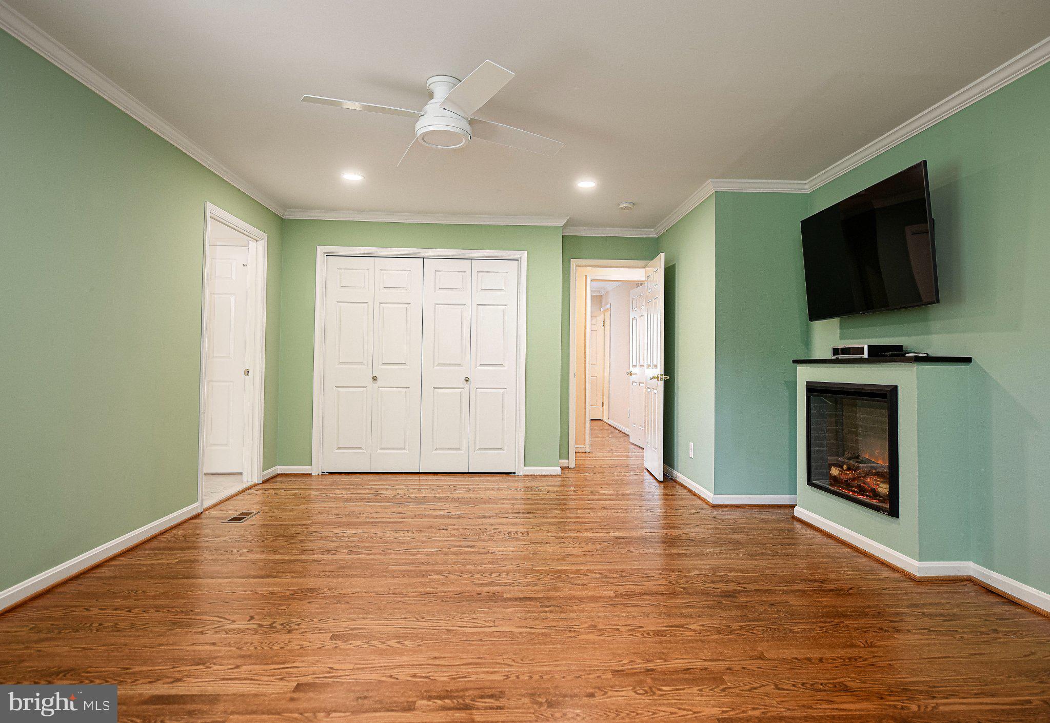 14300 Carroll Ridge Court Baldwin, MD 21013 - Photo 23 of 73 a view of empty room with wooden floor and fireplace