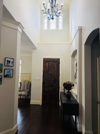 a living room with furniture and a mirror