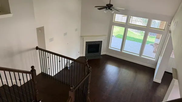 a kitchen with a white cabinets and a refrigerator