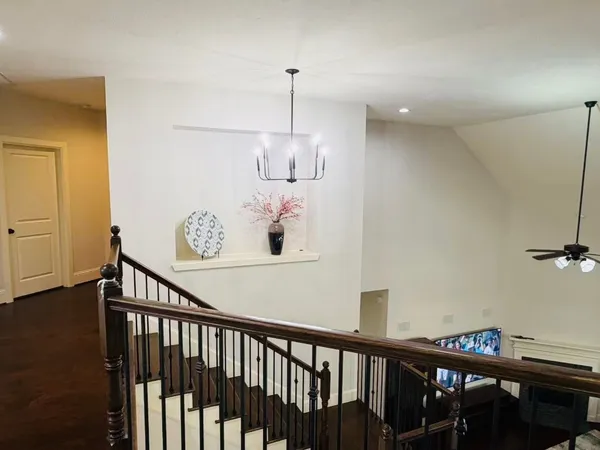 a view of a hallway with seating area