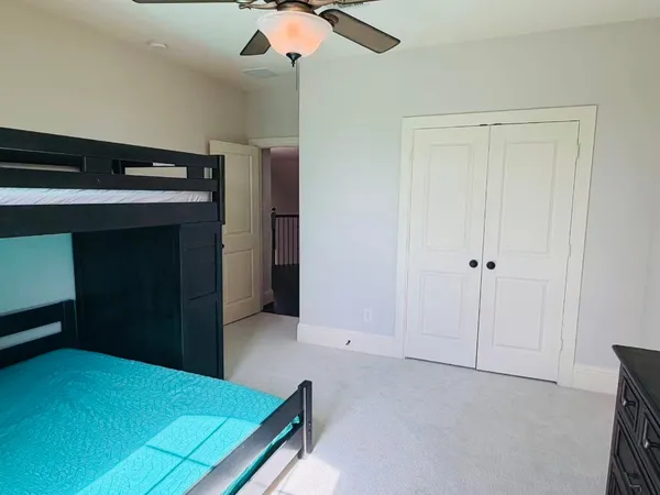 a view of an empty room with a cabinet