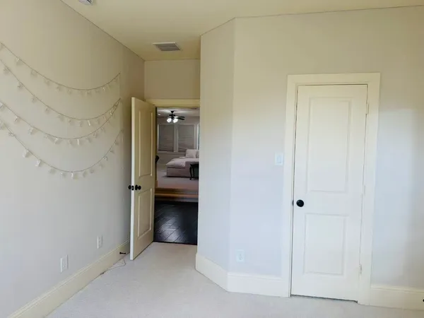 a view of a bedroom from a hallway