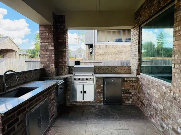 a kitchen with a stove and a sink