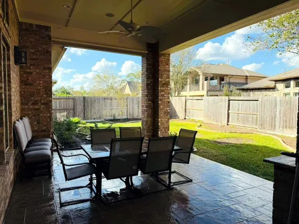 a view of swimming pool with outdoor seating