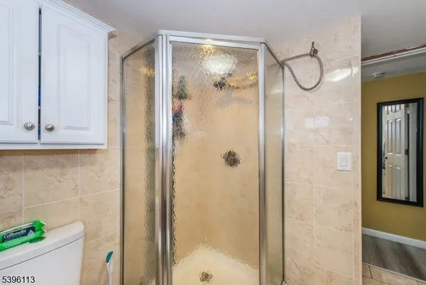 a bathroom with a glass shower door