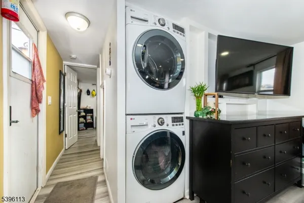 a view of a hallway with washer and dryer