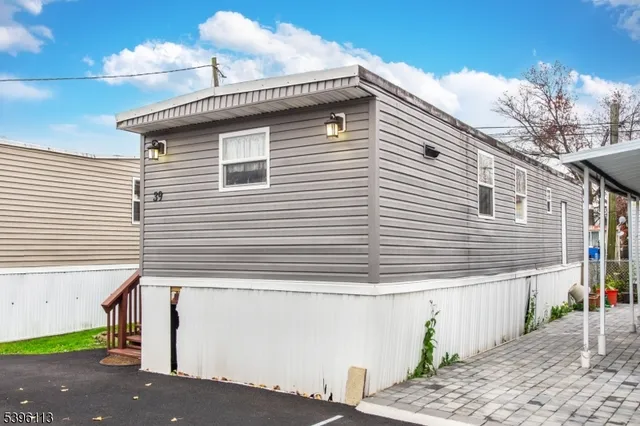 a view of a house with a yard and garage