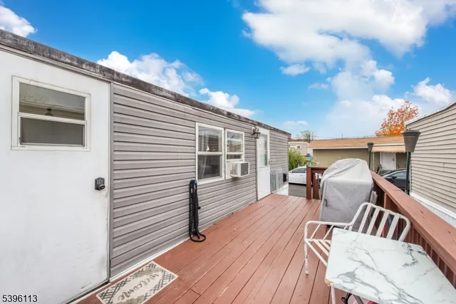 a front view of a house with outdoor seating