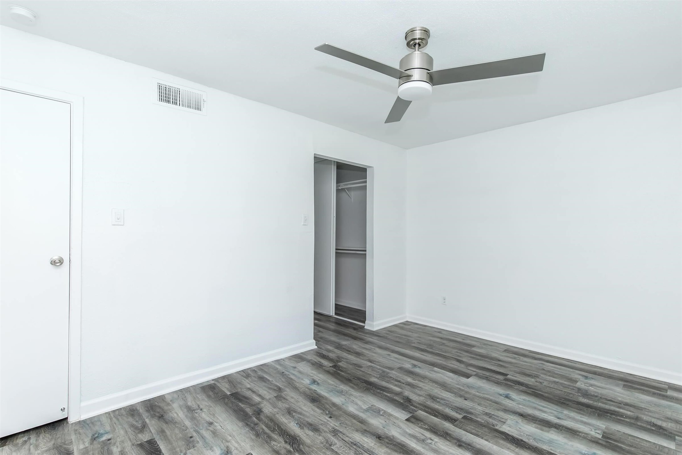 18001 Cypress Trace Road, Unit 2401 Houston, TX 77090 - Photo 9 of 31 a view of a room with wooden floor ceiling fan