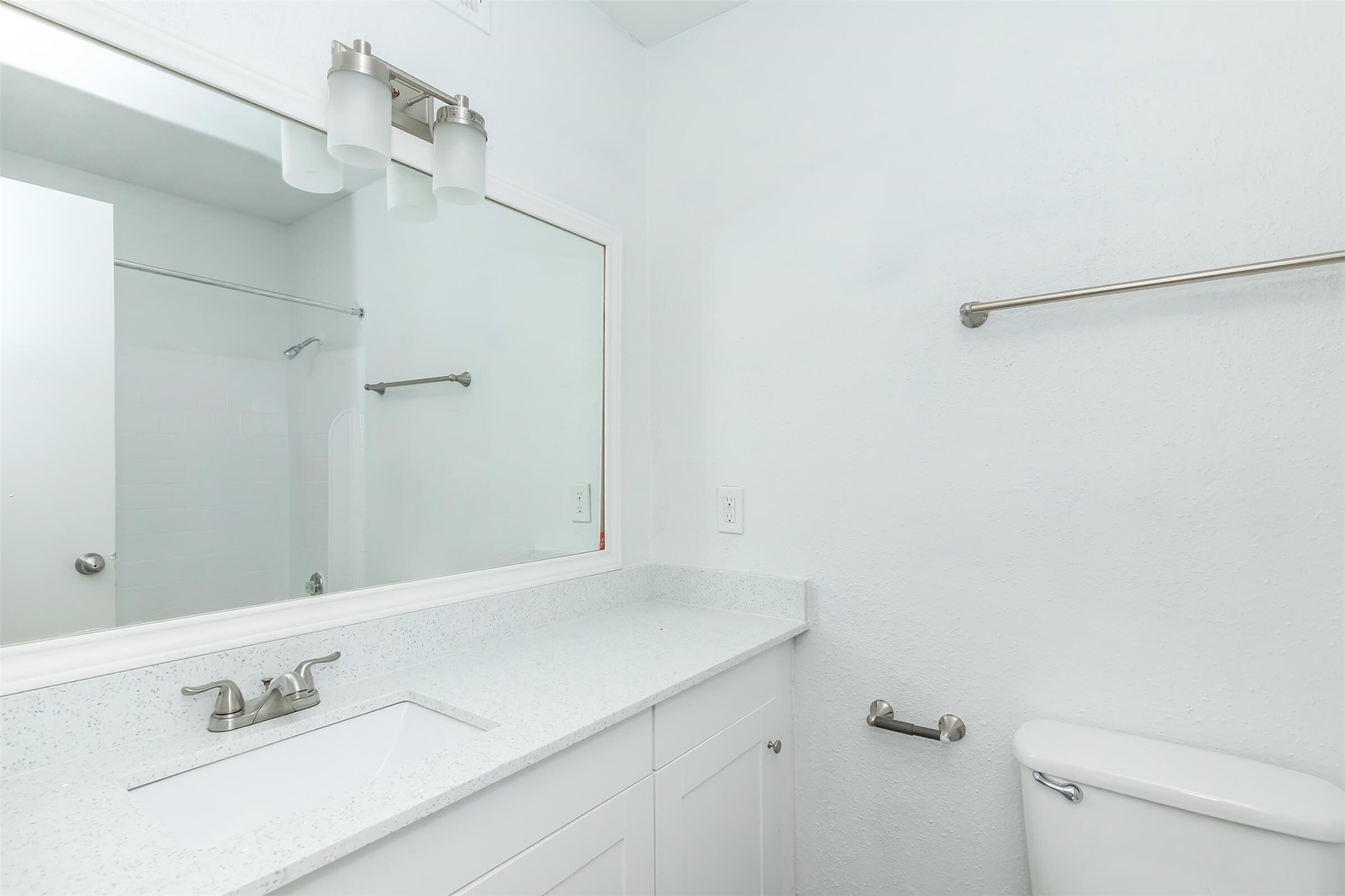 18001 Cypress Trace Road, Unit 2401 Houston, TX 77090 - Photo 10 of 31 a bathroom with a sink and a mirror