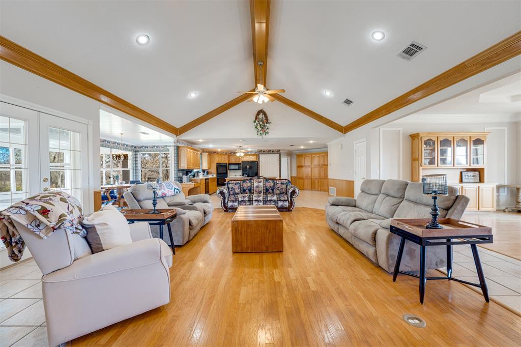 2290 County Road Honey Grove, TX 75446 - Photo 12 of 37 a living room with furniture and a wooden floor