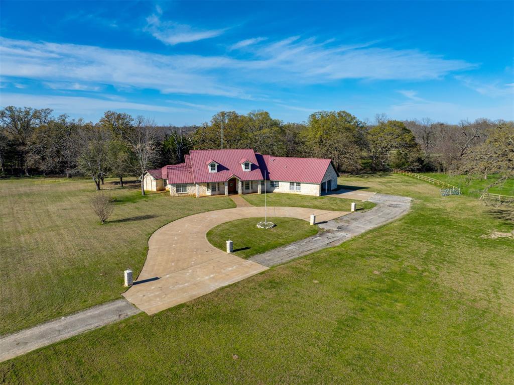 2290 County Road Honey Grove, TX 75446 - Photo 2 of 37 a view of a swimming pool with a yard