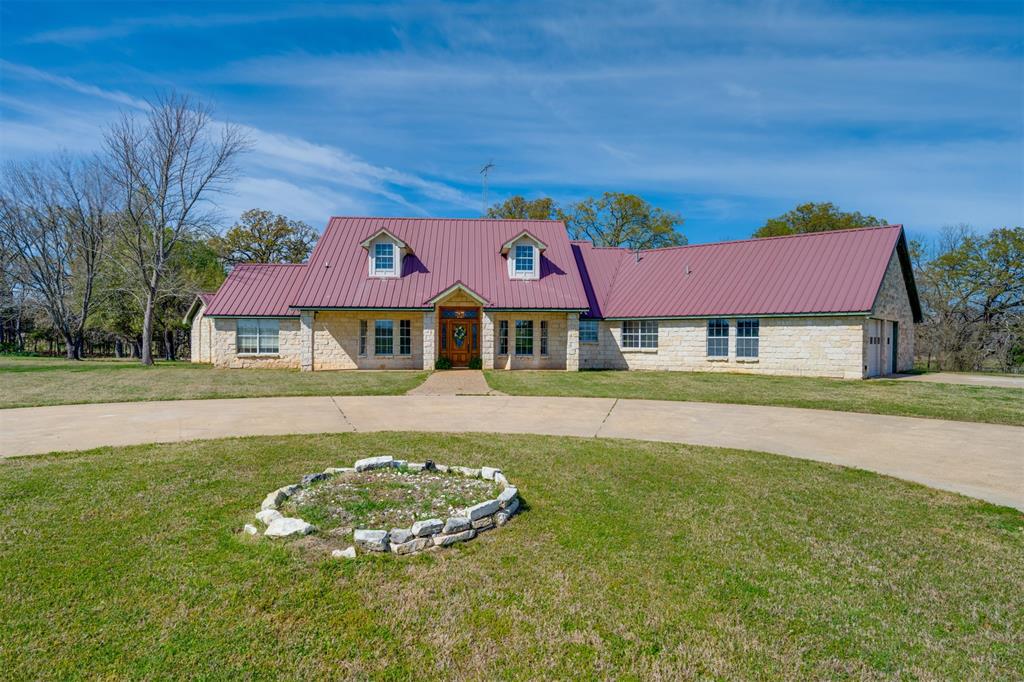 2290 County Road Honey Grove, TX 75446 - Photo 3 of 37 a front view of a house with a yard table and chairs