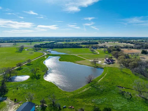 a view of a golf course with a lake view