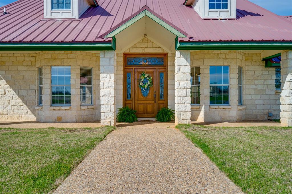 2290 County Road Honey Grove, TX 75446 - Photo 7 of 37 a front view of a house with garden