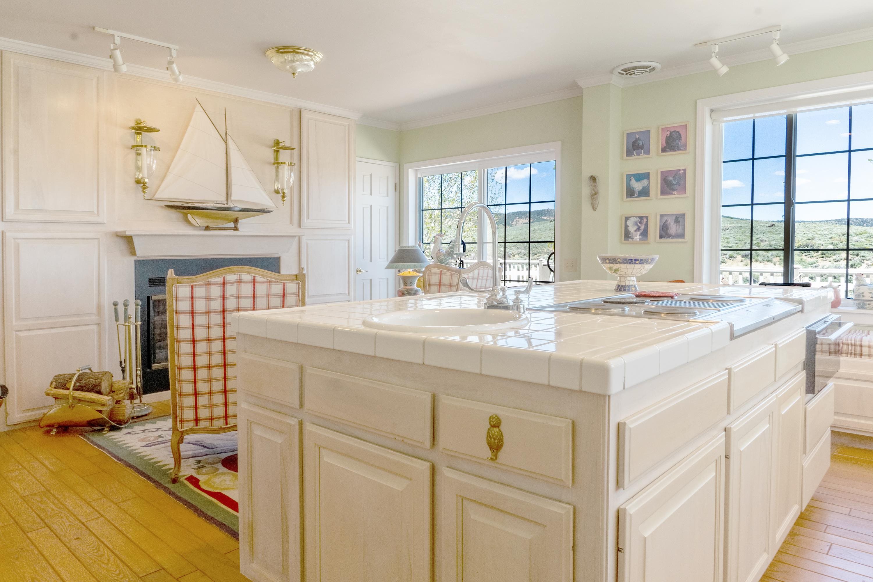416 Wilson Creek Road Lee Vining, CA 93541 - Photo 19 of 64 a kitchen with kitchen island a sink stove and cabinets